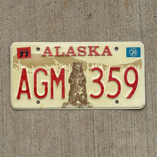 Photo of a 1976 1977 Alaska License Plate Auto Tag 1 Vintage Standing Bear AGM 359 with original patina
