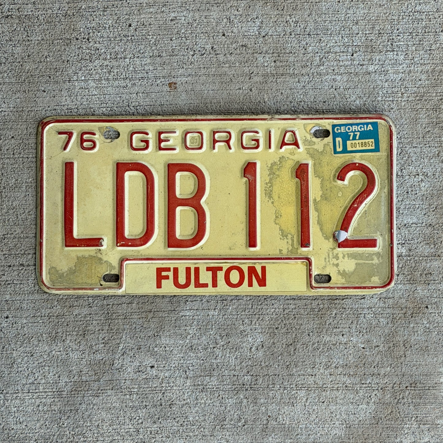 Photo of a 1976 1977 Georgia License Plate Auto Tag Garage Decor Vintage LDB 112 with original patina