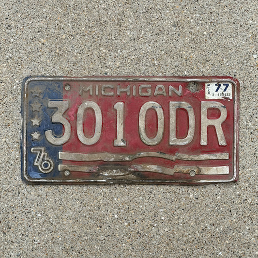 Photo of a 1976 1977 Michigan Commercial License Plate Auto Tag Garage Decor Vintage Bicentennial 3010 DR with original patina