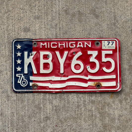 Photo of a 1976 1977 Michigan License Plate Auto Tag Garage Decor Vintage American Flag Bicentennial KBY 635 with original patina
