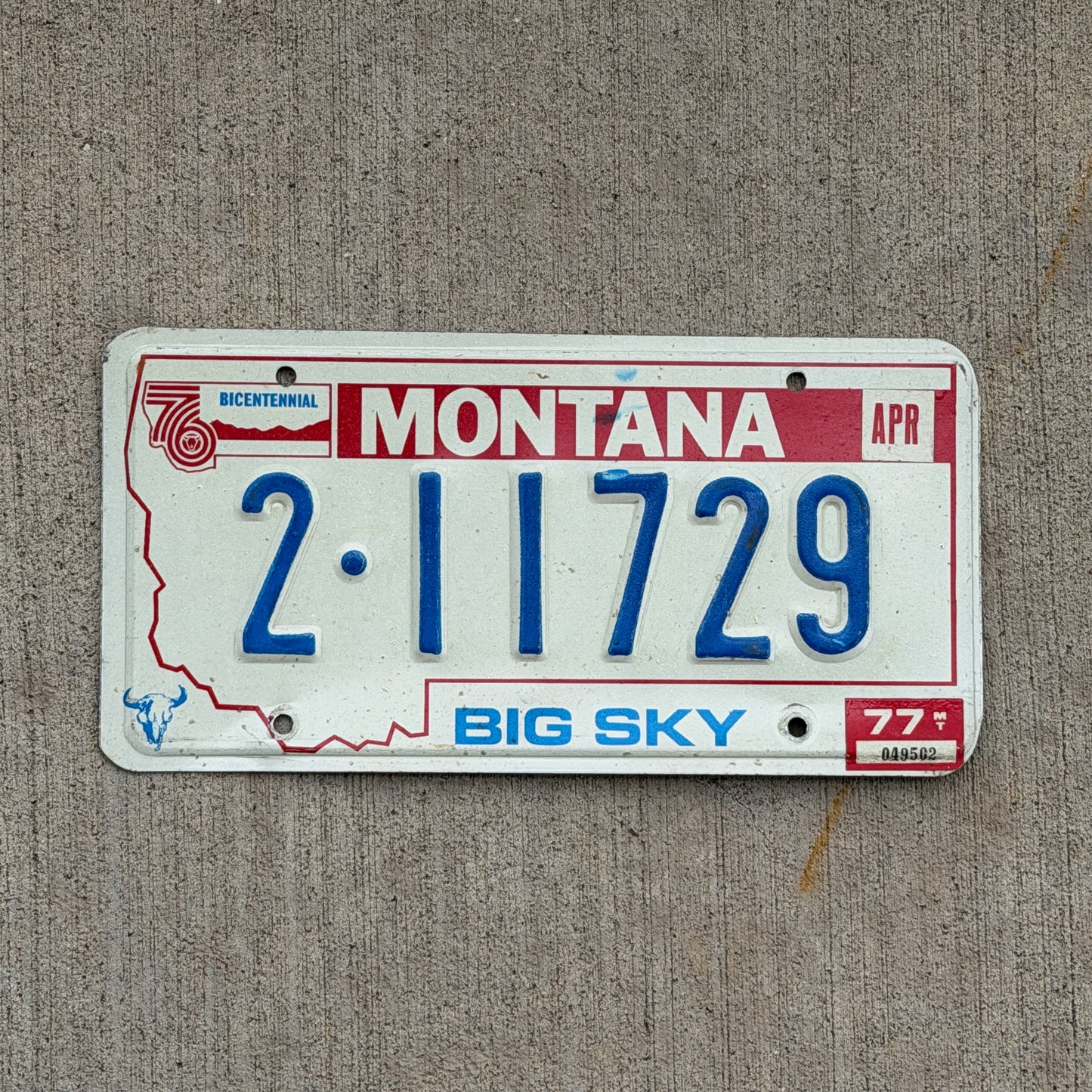 Photo of a 1976 1977 Montana License Plate Auto Tag 2 Vintage Garage Bicentennial 2 11729 with original patina