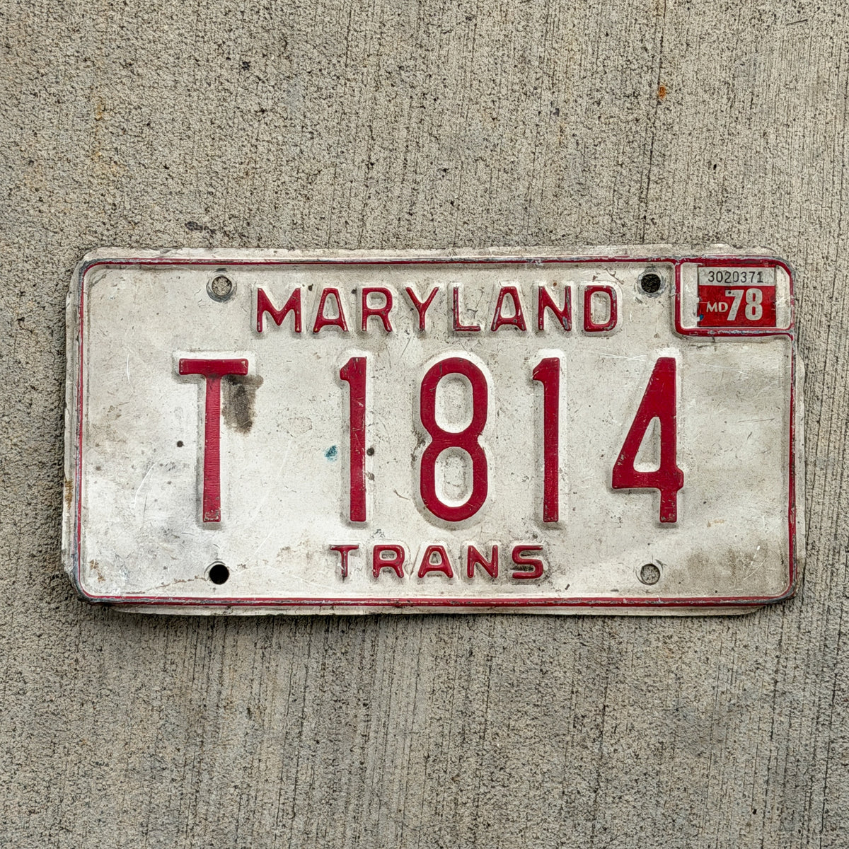 Photo of a 1976 1978 Maryland Transporter License Plate Auto Tag Garage Decor Vintage T 1814 with original patina