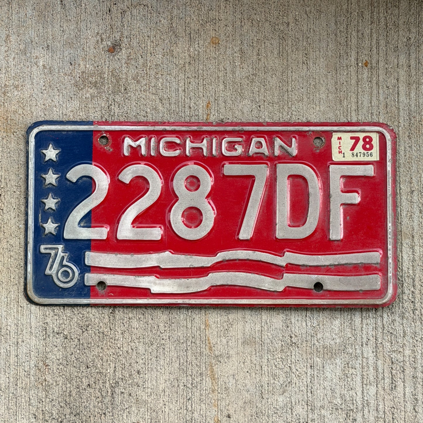 Photo of a 1976 1978 Michigan Commercial License Plate Auto Tag Garage Decor Vintage Bicentennial 2287 DF with original patina