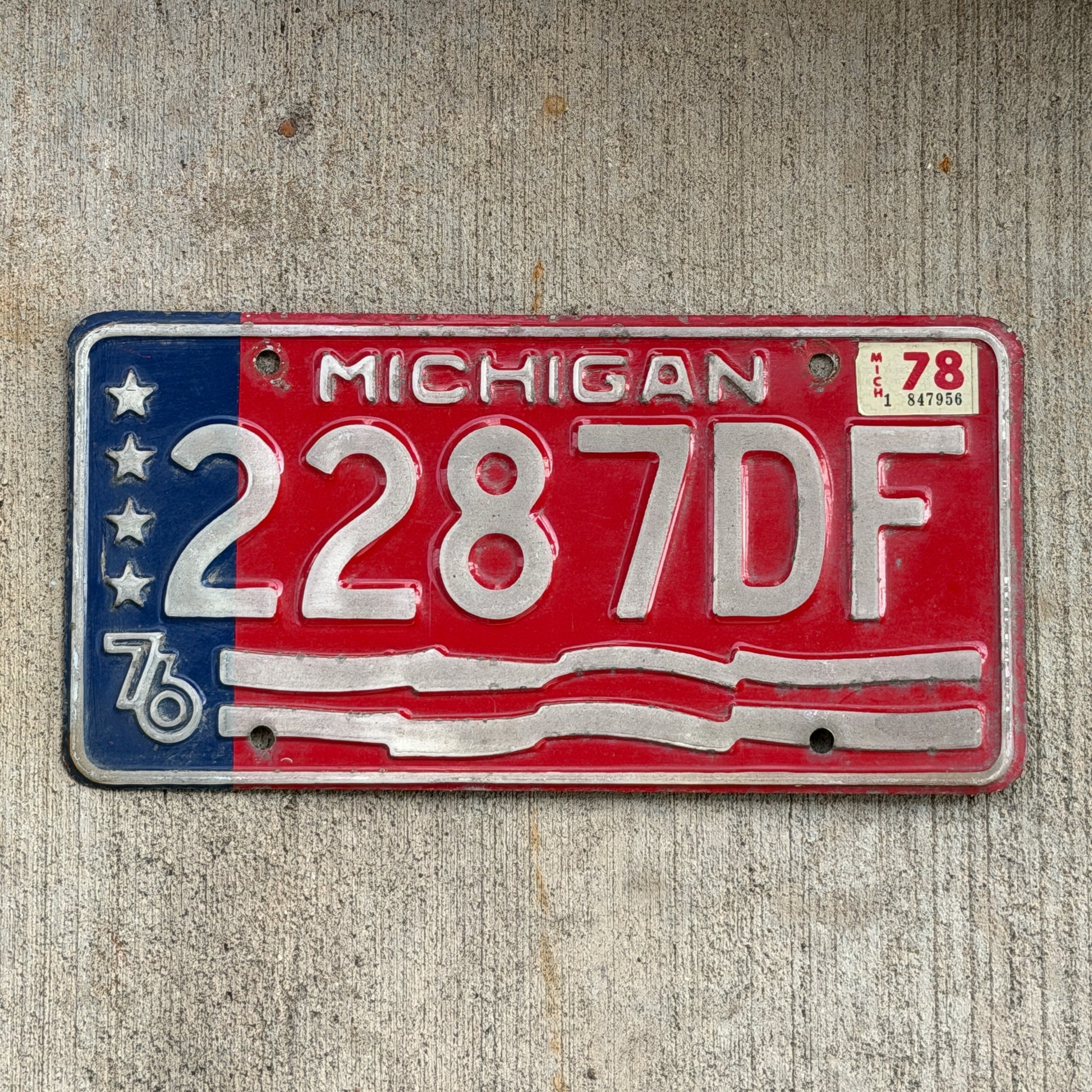 Photo of a 1976 1978 Michigan Commercial License Plate Auto Tag Garage Decor Vintage Bicentennial 2287 DF with original patina