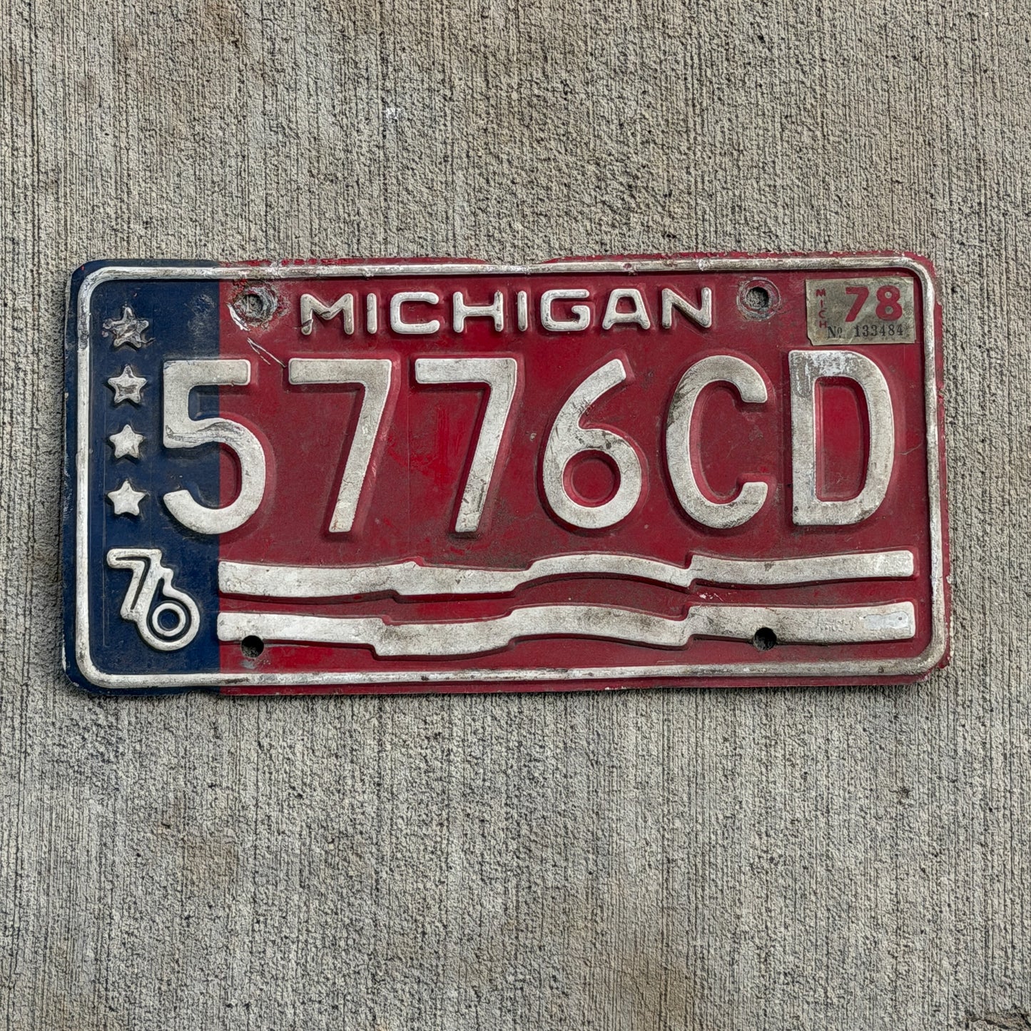 Photo of a 1976 1978 Michigan Commercial License Plate Auto Tag Garage Decor Vintage Bicentennial 5776 CD with original patina