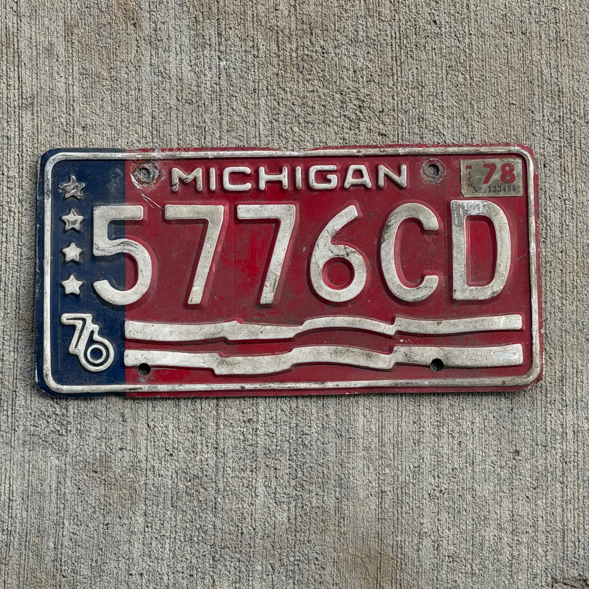Photo of a 1976 1978 Michigan Commercial License Plate Auto Tag Garage Decor Vintage Bicentennial 5776 CD with original patina