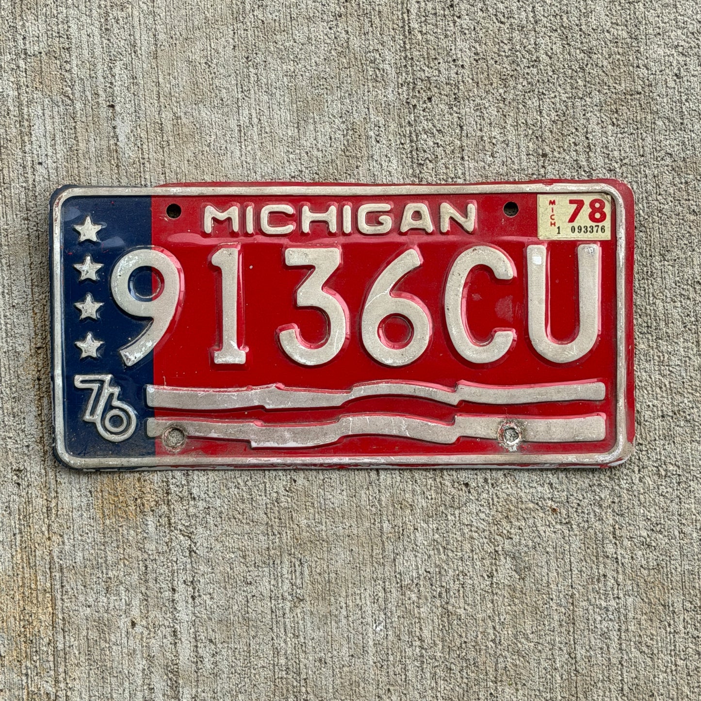 Photo of a 1976 1978 Michigan Commercial License Plate Auto Tag Garage Decor Vintage Bicentennial 9136 CU with original patina