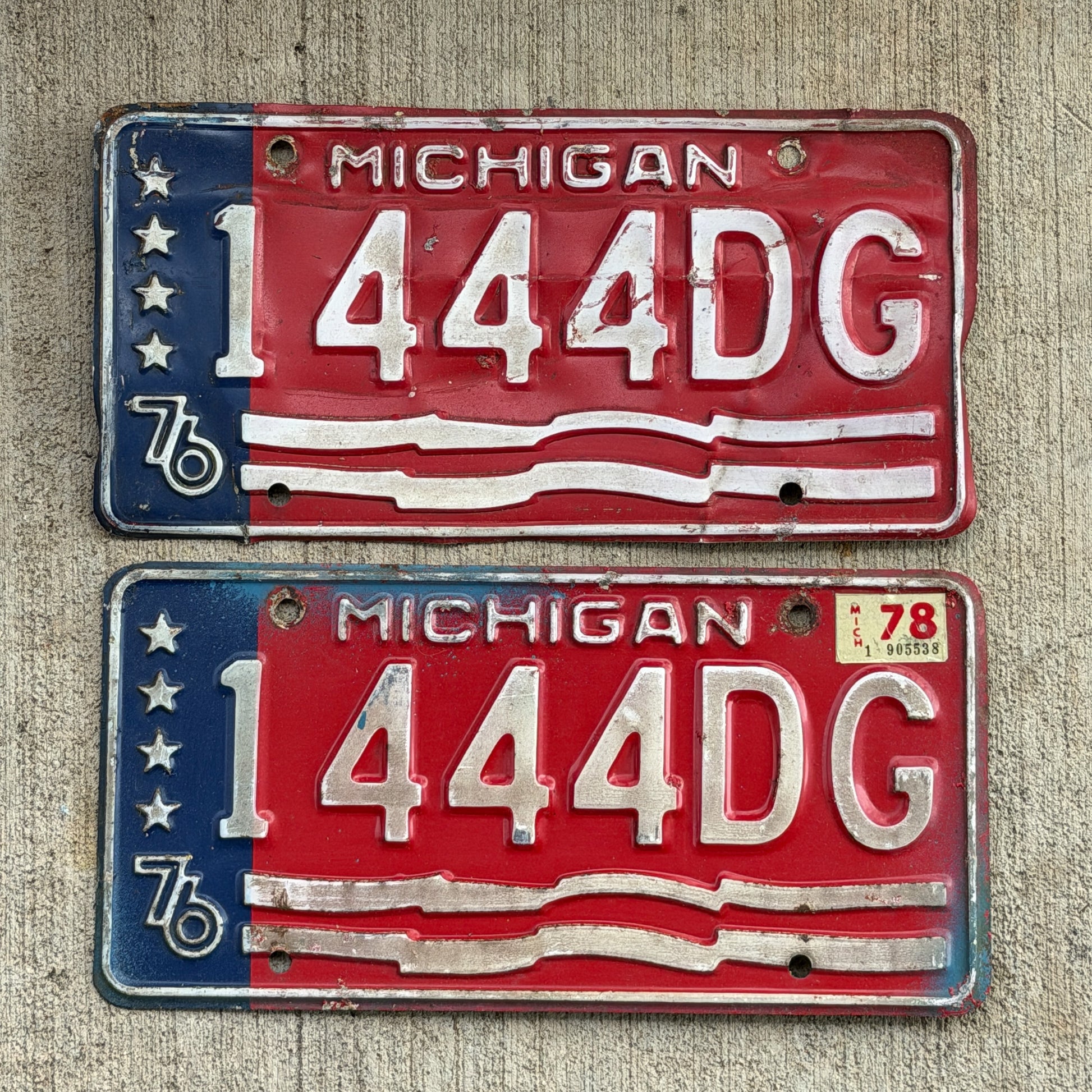 Photo of a 1976 1978 Michigan Commercial License Plate Pair Auto Tag Garage Decor Vintage Bicentennial Repeat Repeating 1444 DG with original patina