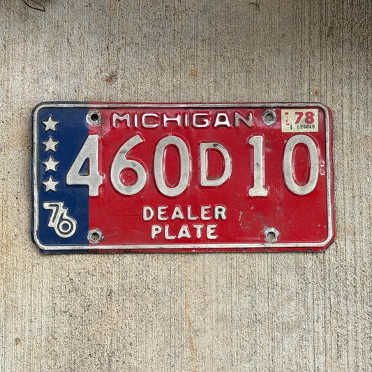 Photo of a 1976 1978 Michigan Dealer License Plate Auto Tag Garage Decor Vintage Bicentennial 460 D 10 with original patina