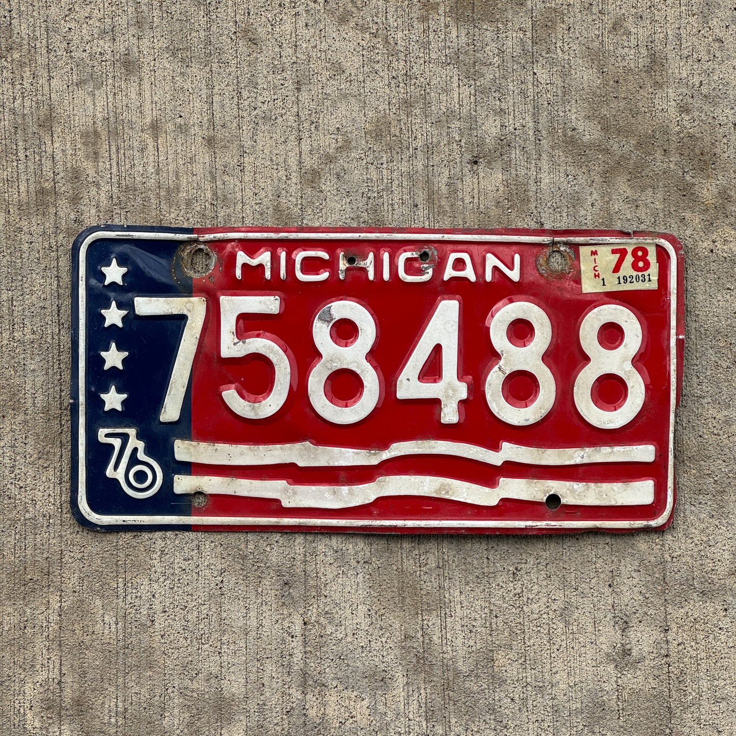 Photo of a 1976 1978 Michigan License Plate Auto Tag Garage Decor Vintage American Flag Bicentennial 758 488 with original patina