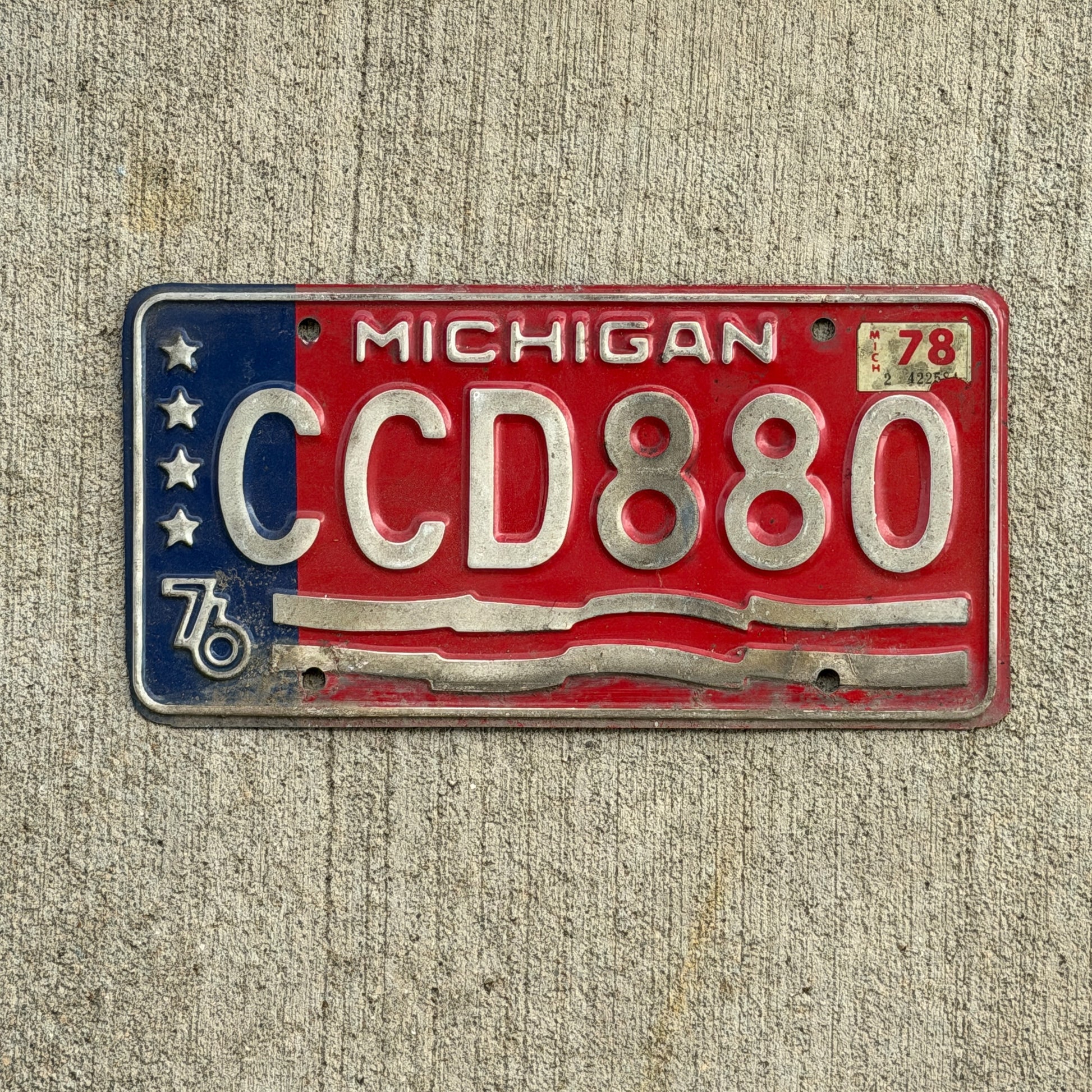 Photo of a 1976 1978 Michigan License Plate Auto Tag Garage Decor Vintage Bicentennial CCD 880 with original patina