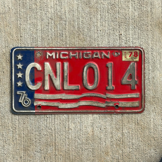 Photo of a 1976 1978 Michigan License Plate Auto Tag Garage Decor Vintage Bicentennial CNL 014 with original patina