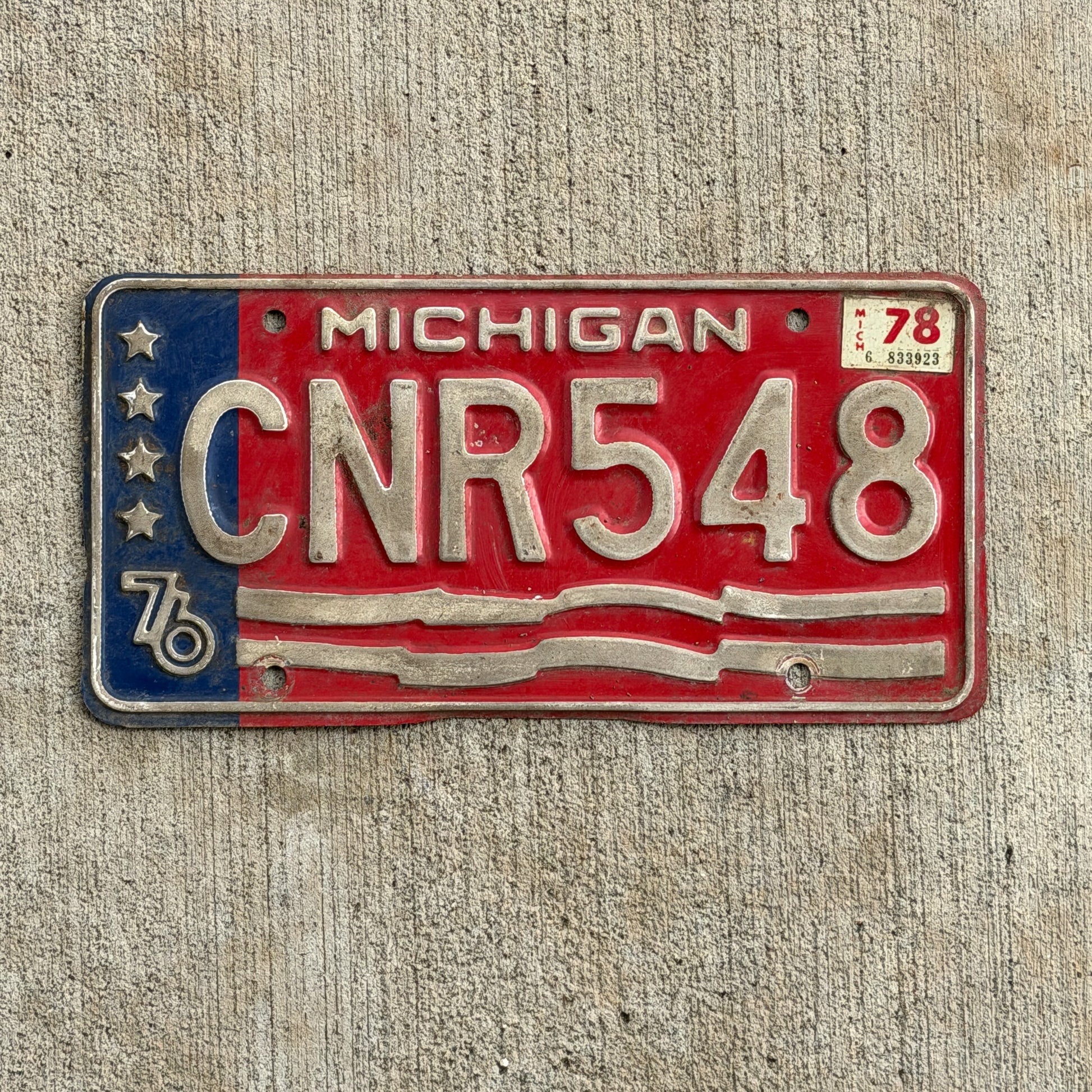 Photo of a 1976 1978 Michigan License Plate Auto Tag Garage Decor Vintage Bicentennial CNR 548 with original patina