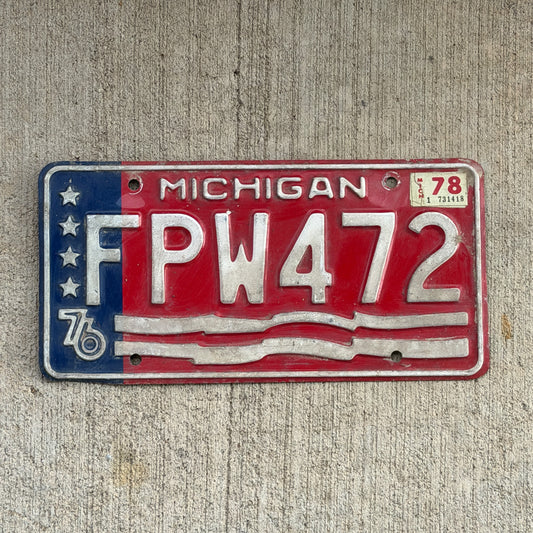 Photo of a 1976 1978 Michigan License Plate Auto Tag Garage Decor Vintage Bicentennial FPW 472 with original patina