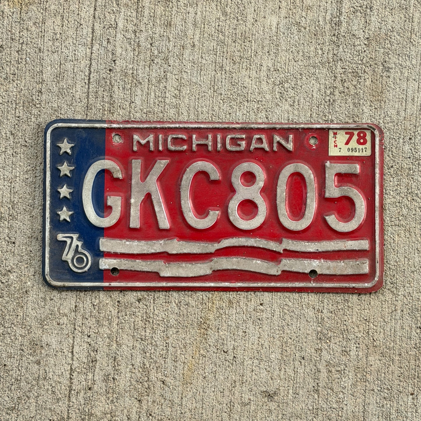 Photo of a 1976 1978 Michigan License Plate Auto Tag Garage Decor Vintage Bicentennial GKC 805 with original patina