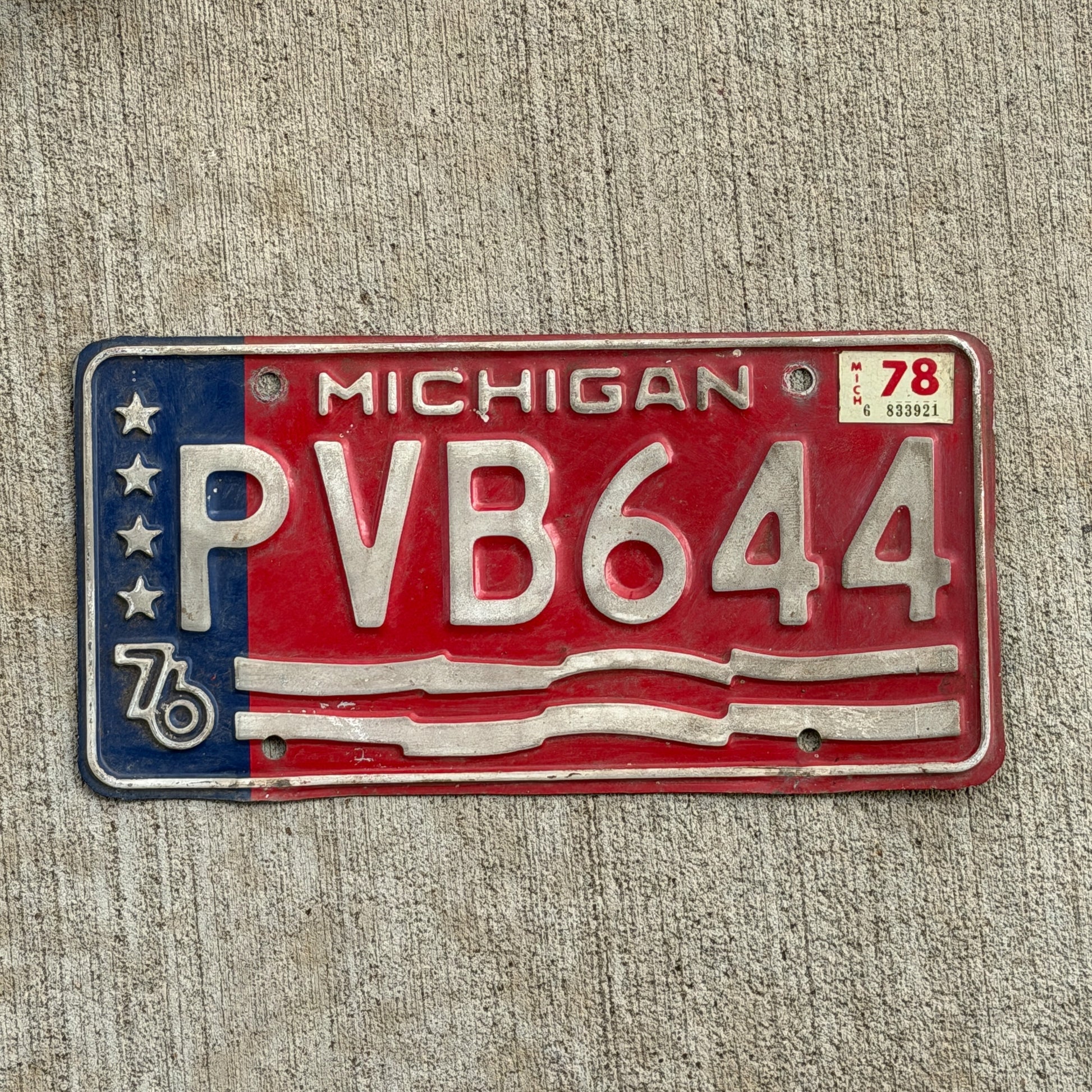 Photo of a 1976 1978 Michigan License Plate Auto Tag Garage Decor Vintage Bicentennial PVB 644 with original patina
