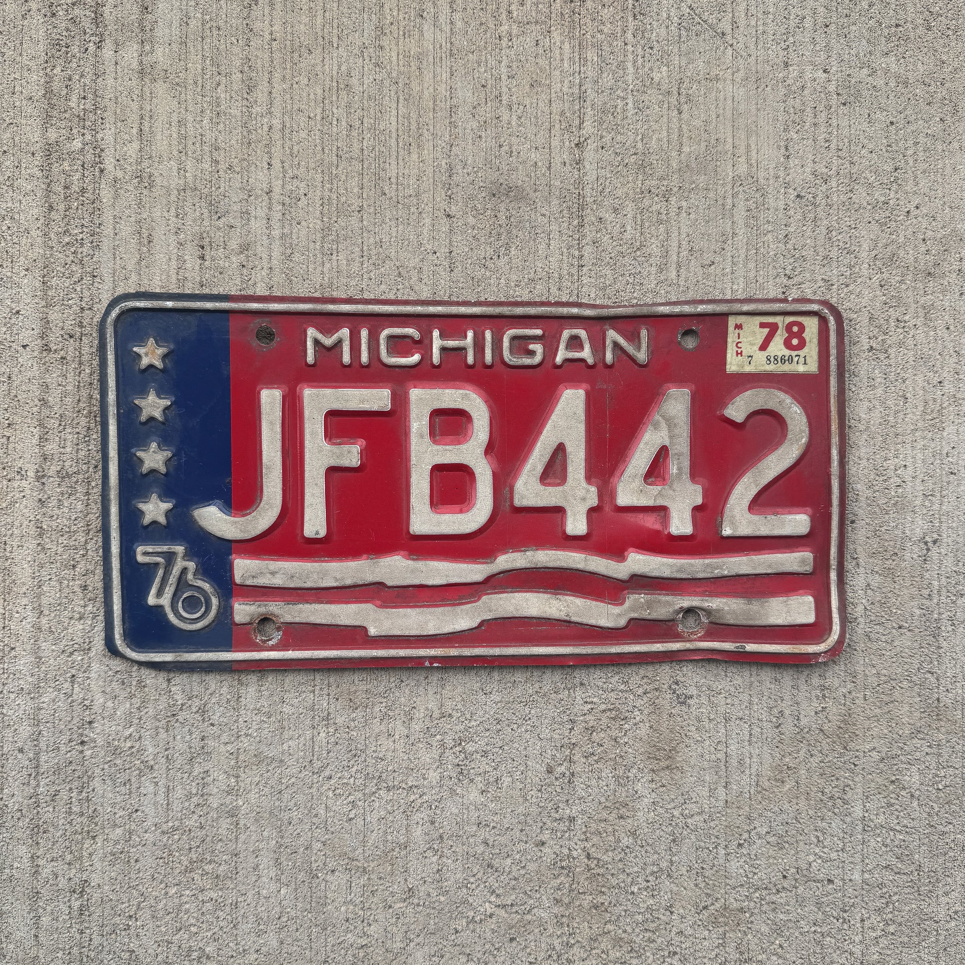 Photo of a 1976 1978 Michigan License Plate Auto Tag Garage Decor Vintage JFB 442 with original patina