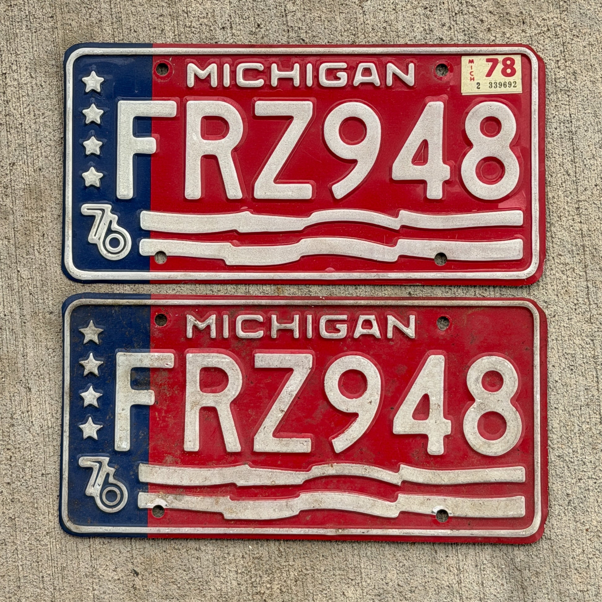 Photo of a 1976 1978 Michigan License Plate Pair Auto Tag Garage Decor Vintage Bicentennial FRZ 948 with original patina