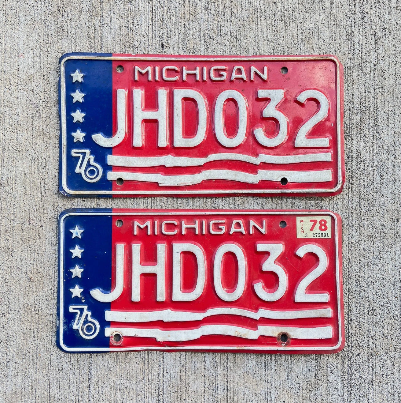 Photo of a 1976 1978 Michigan License Plate Pair Auto Tag Garage Decor Vintage Bicentennial JHD 032 with original patina