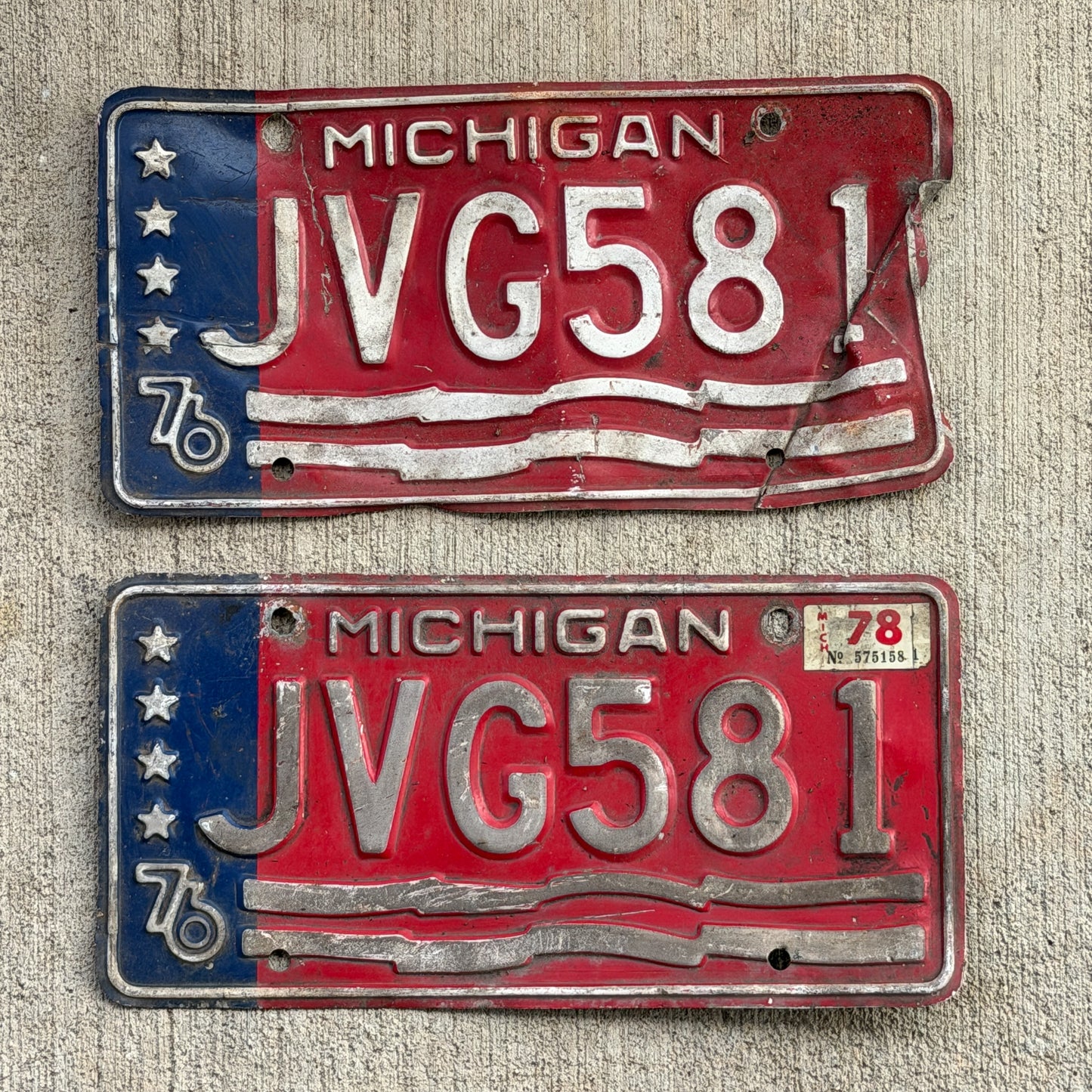 Photo of a 1976 1978 Michigan License Plate Pair Auto Tag Garage Decor Vintage Bicentennial JVG 581 with original patina
