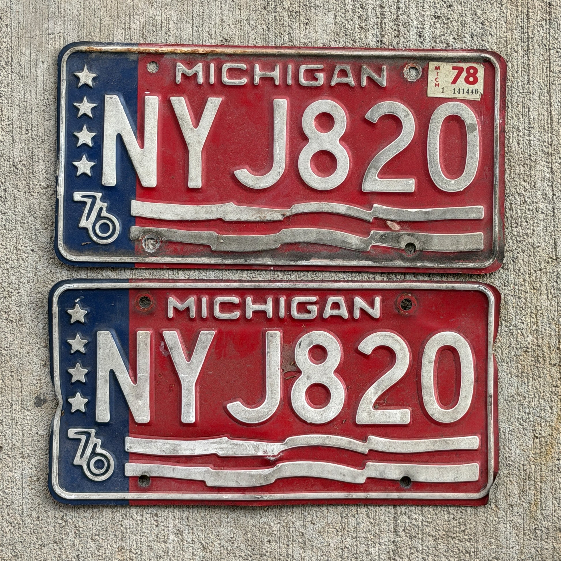 Photo of a 1976 1978 Michigan License Plate Pair Auto Tag Garage Decor Vintage Bicentennial NYJ 820 with original patina