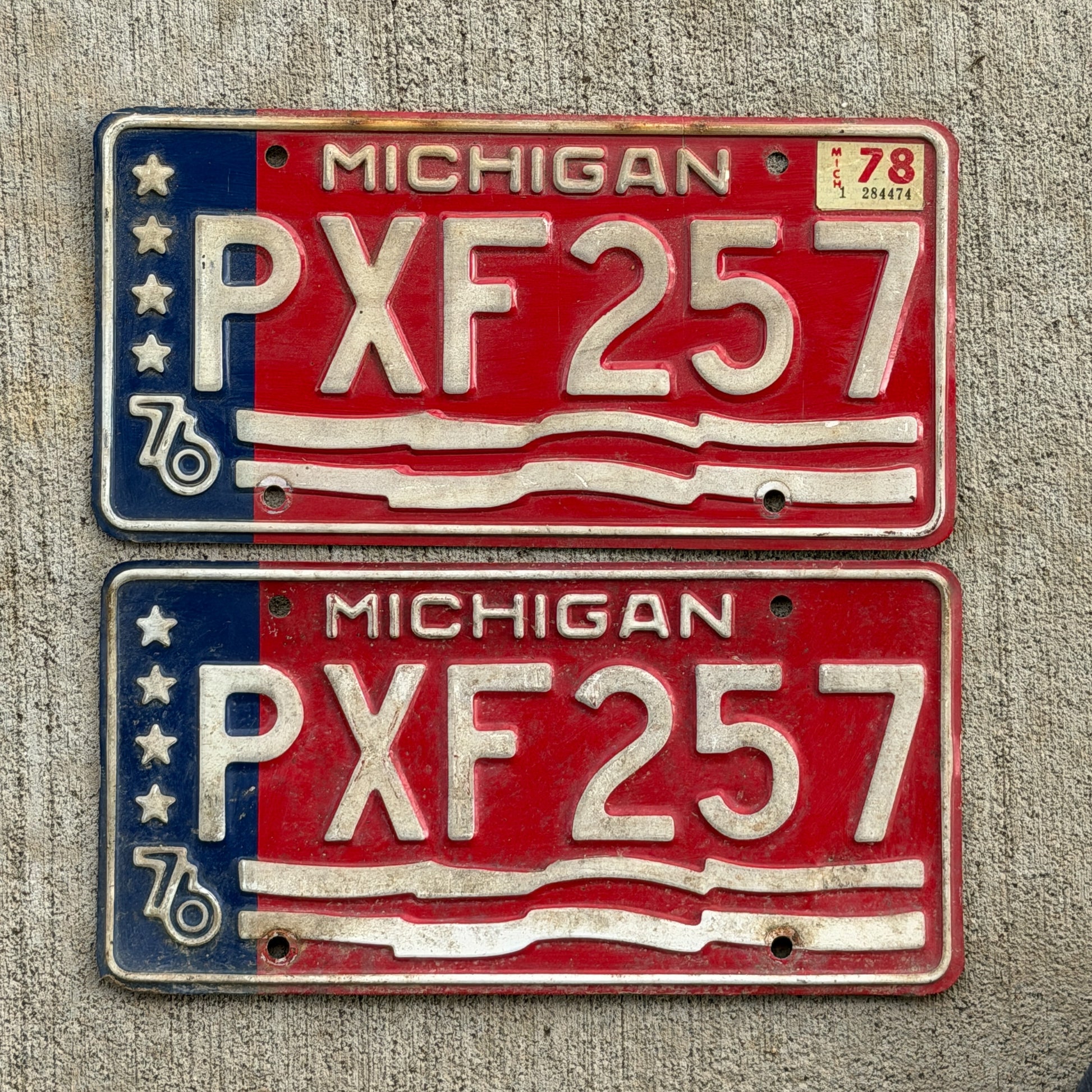 Photo of a 1976 1978 Michigan License Plate Pair Auto Tag Garage Decor Vintage Bicentennial PXF 257 with original patina