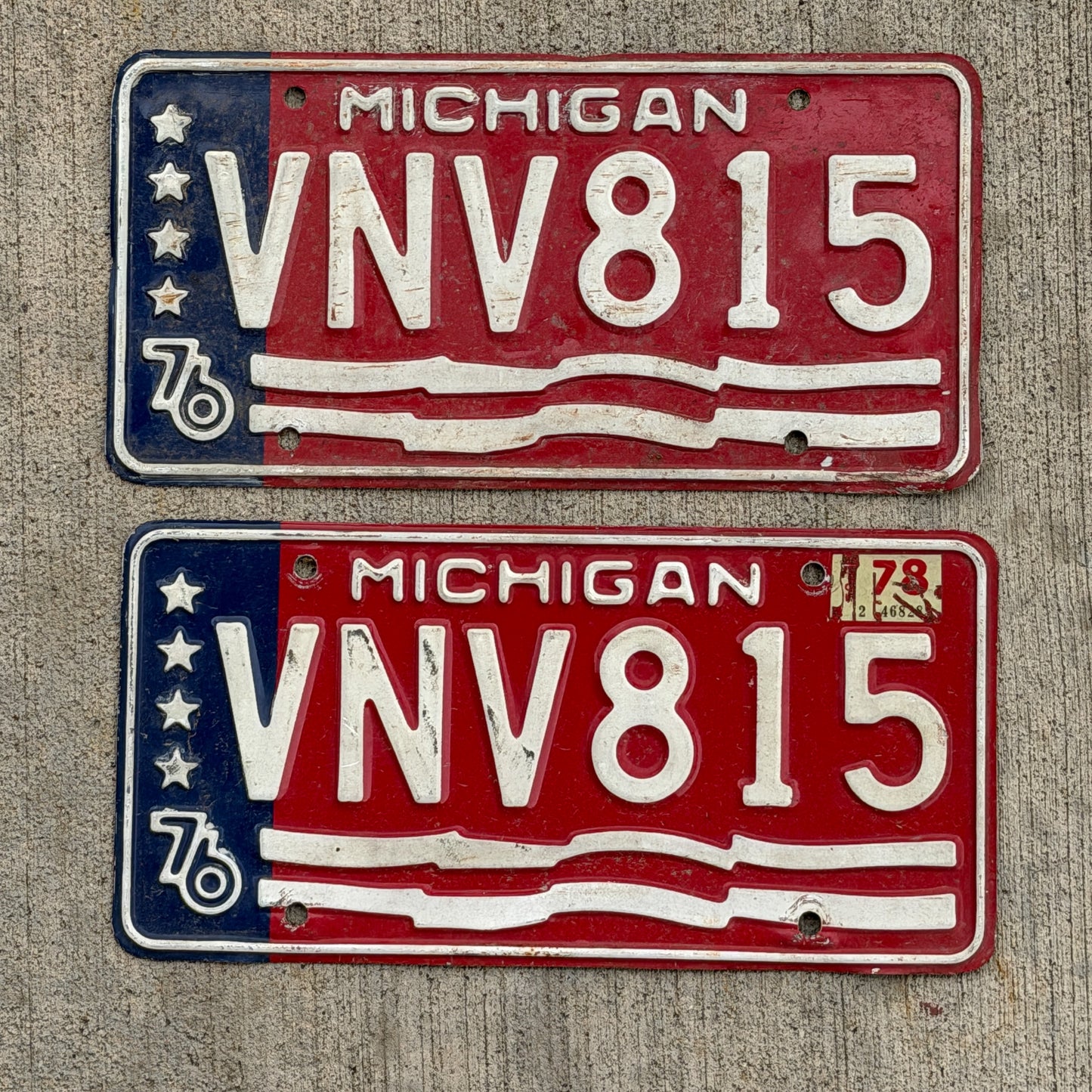 Photo of a 1976 1978 Michigan License Plate Pair Auto Tag Garage Decor Vintage Bicentennial VNV 815 with original patina