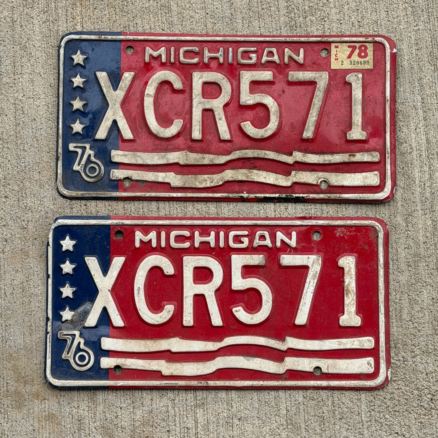 Photo of a 1976 1978 Michigan License Plate Pair Auto Tag Garage Decor Vintage Bicentennial XCR 571 with original patina