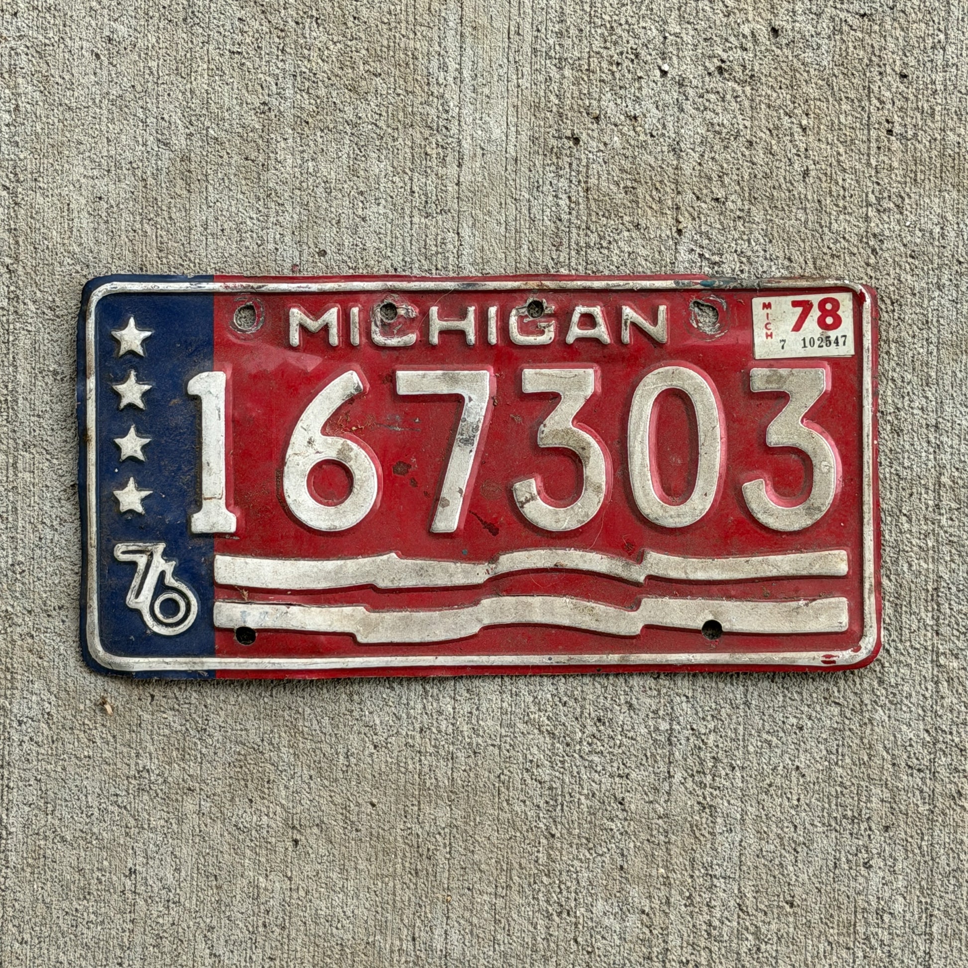 Photo of a 1976 1978 Michigan Trailer License Plate Auto Tag Garage Decor Vintage Bicentennial 167 303 with original patina