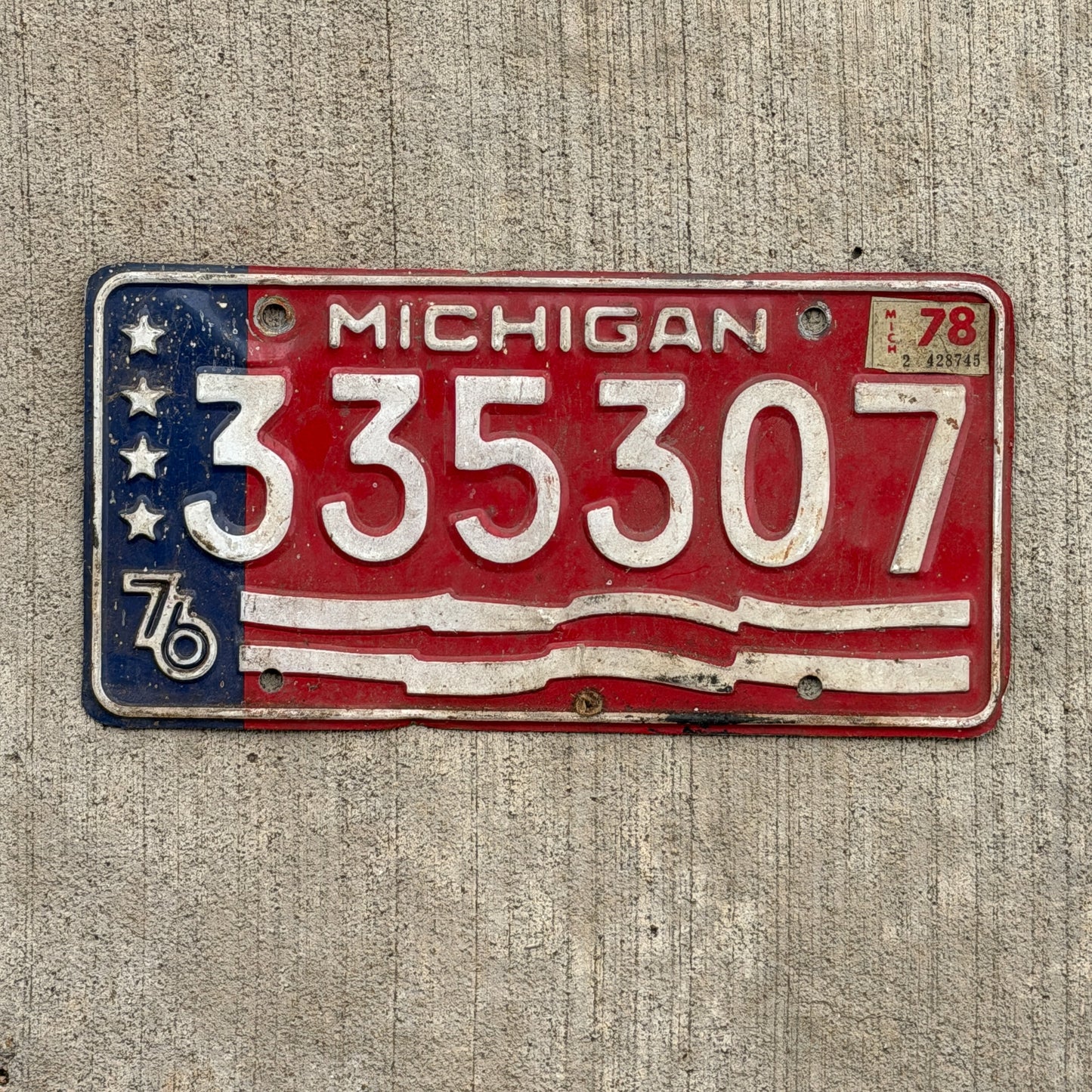 Photo of a 1976 1978 Michigan Trailer License Plate Auto Tag Garage Decor Vintage Bicentennial 335 307 with original patina