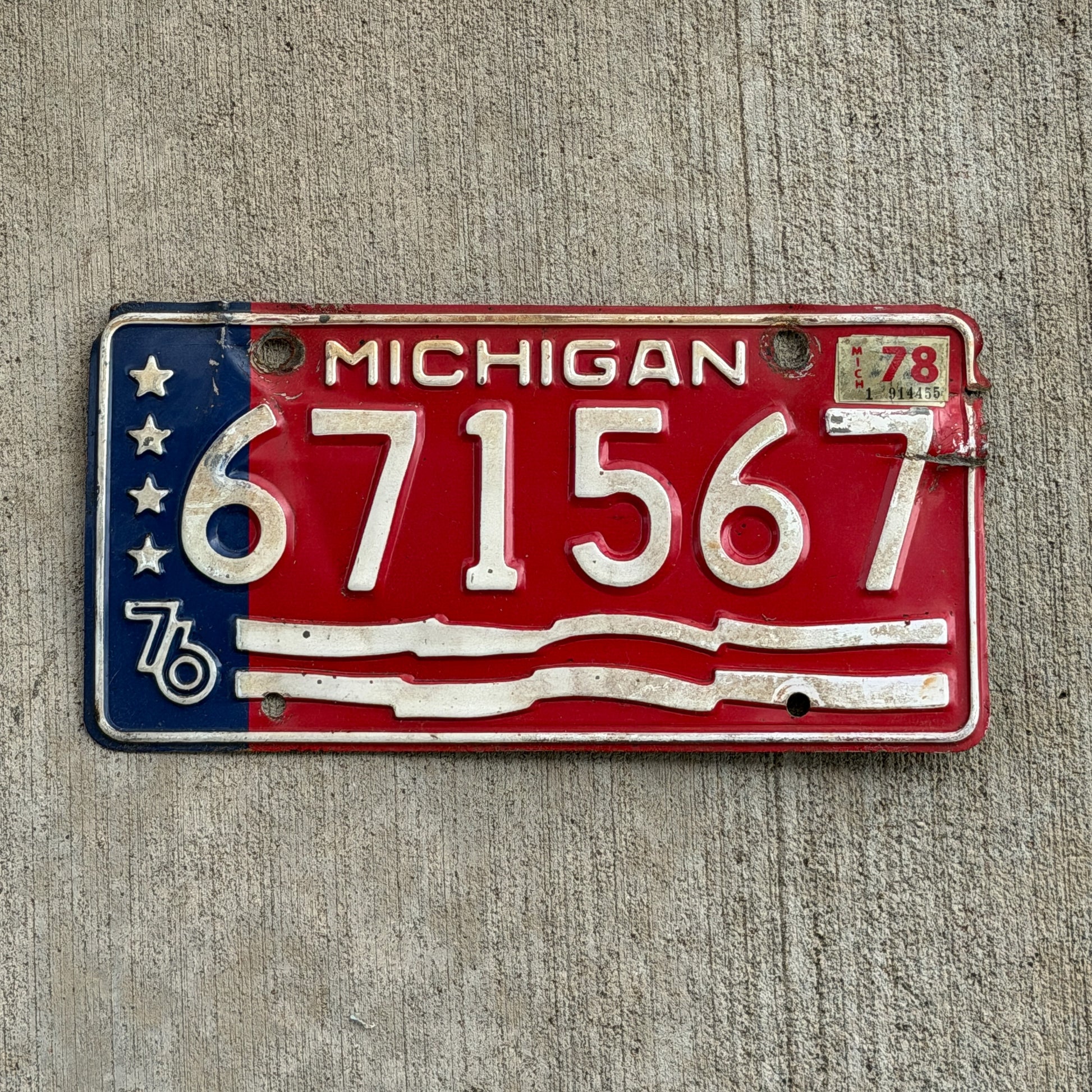 Photo of a 1976 1978 Michigan Trailer License Plate Auto Tag Garage Decor Vintage Bicentennial 671 567 with original patina