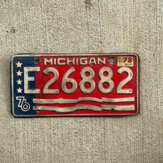 Photo of a 1976 1978 Michigan Trailer License Plate Auto Tag Garage Decor Vintage Bicentennial E 26882 with original patina