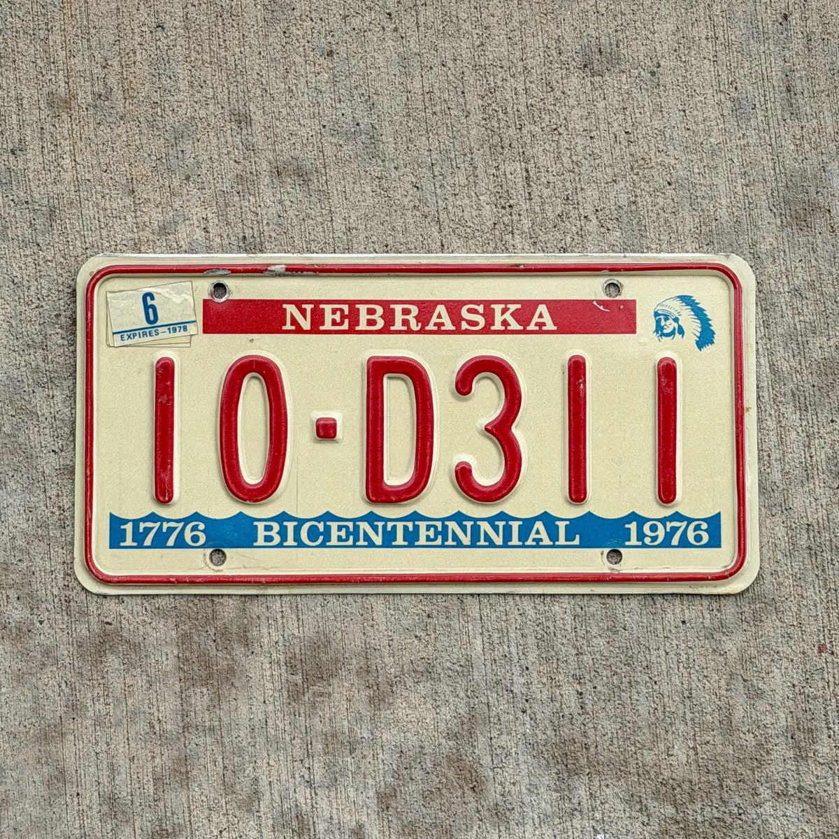Photo of a 1976 1978 Nebraska License Plate Auto Tag Garage Decor Vintage Bicentennial 10 D311 with original patina