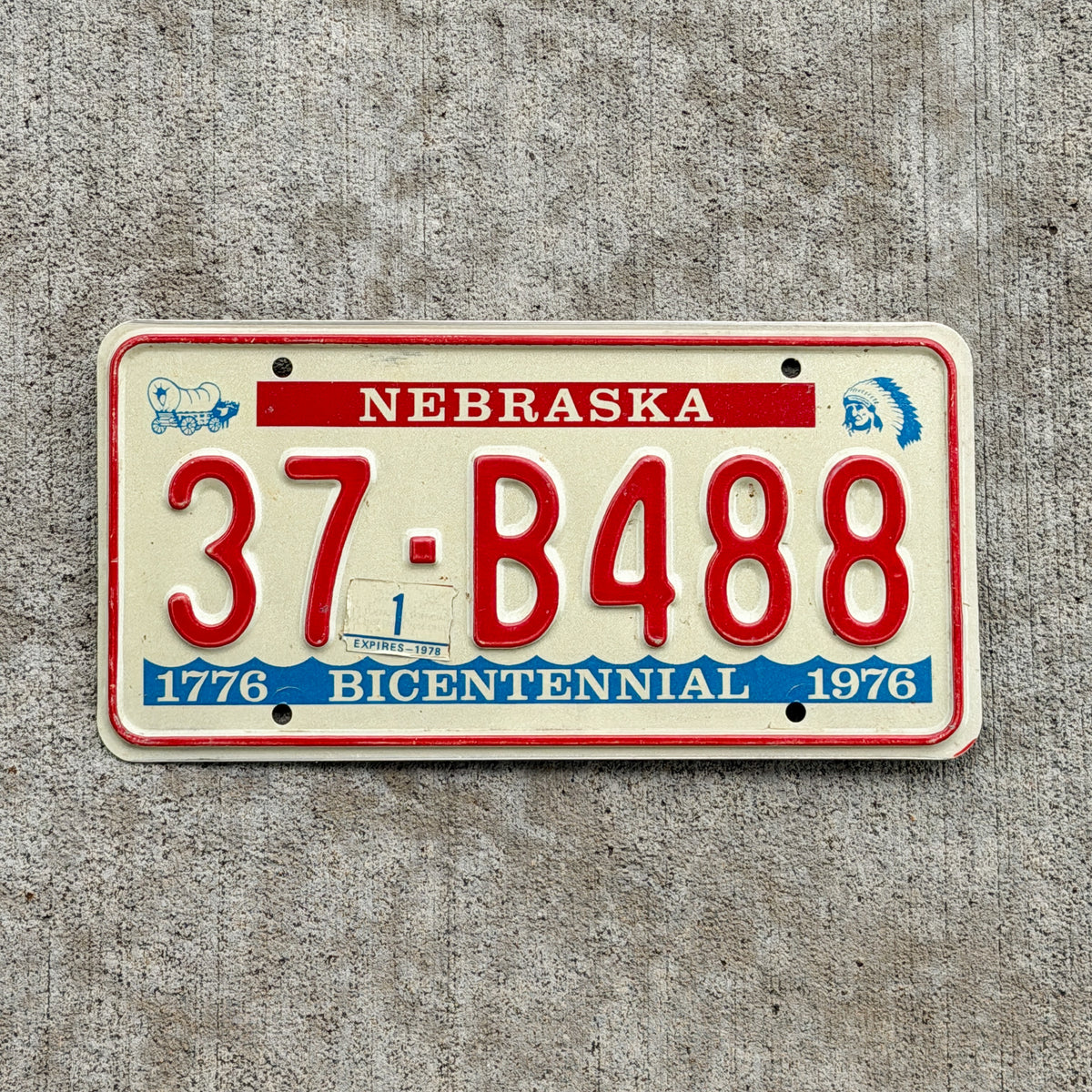 Photo of a 1976 1978 Nebraska License Plate Auto Tag Garage Decor Vintage Bicentennial 37 B488 with original patina