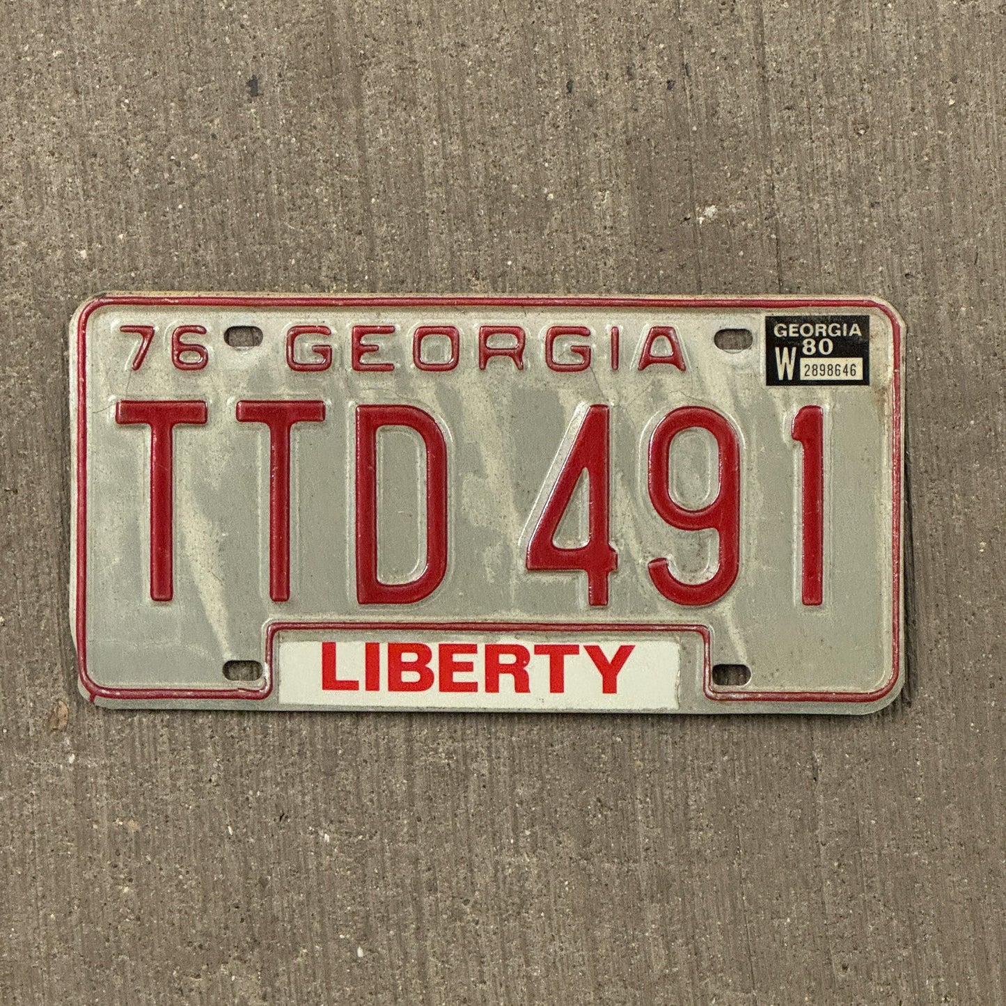 Photo of a 1976 1980 Georgia License Plate Auto Tag Garage Decor Vintage TTD 491 with original patina