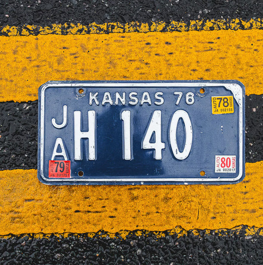 Photo of a 1976 1980 Kansas License Plate Auto Tag Garage Decor Vintage JA H 140 with original patina