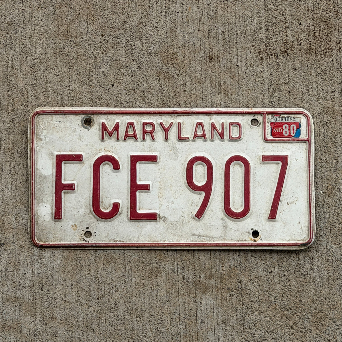 Photo of a 1976 1980 Maryland License Plate Auto Tag Garage Decor Vintage FCE 907 with original patina