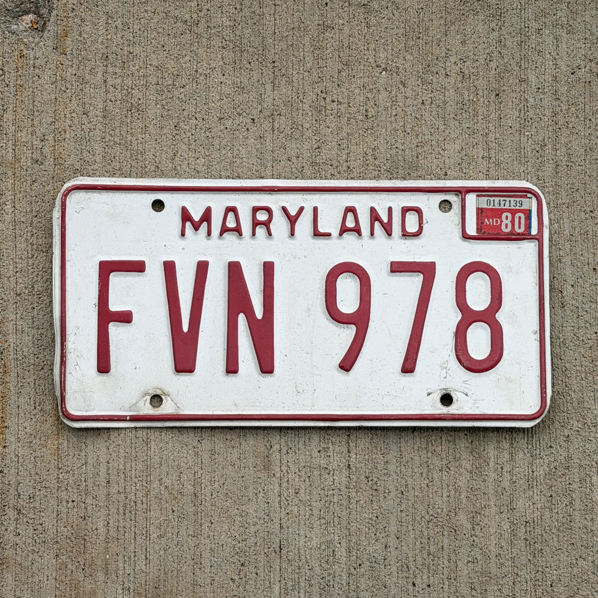 Photo of a 1976 1980 Maryland License Plate Auto Tag Garage Decor Vintage FVN 978 with original patina