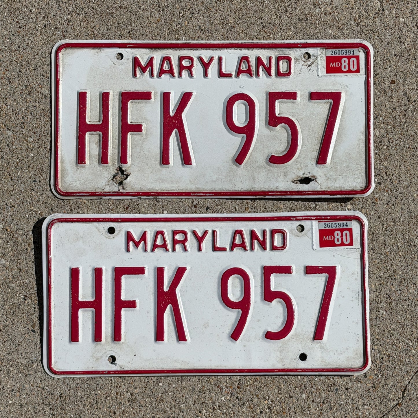 Photo of a 1976 1980 Maryland License Plate Pair Auto Tag Garage Decor Vintage HFK 957 with original patina