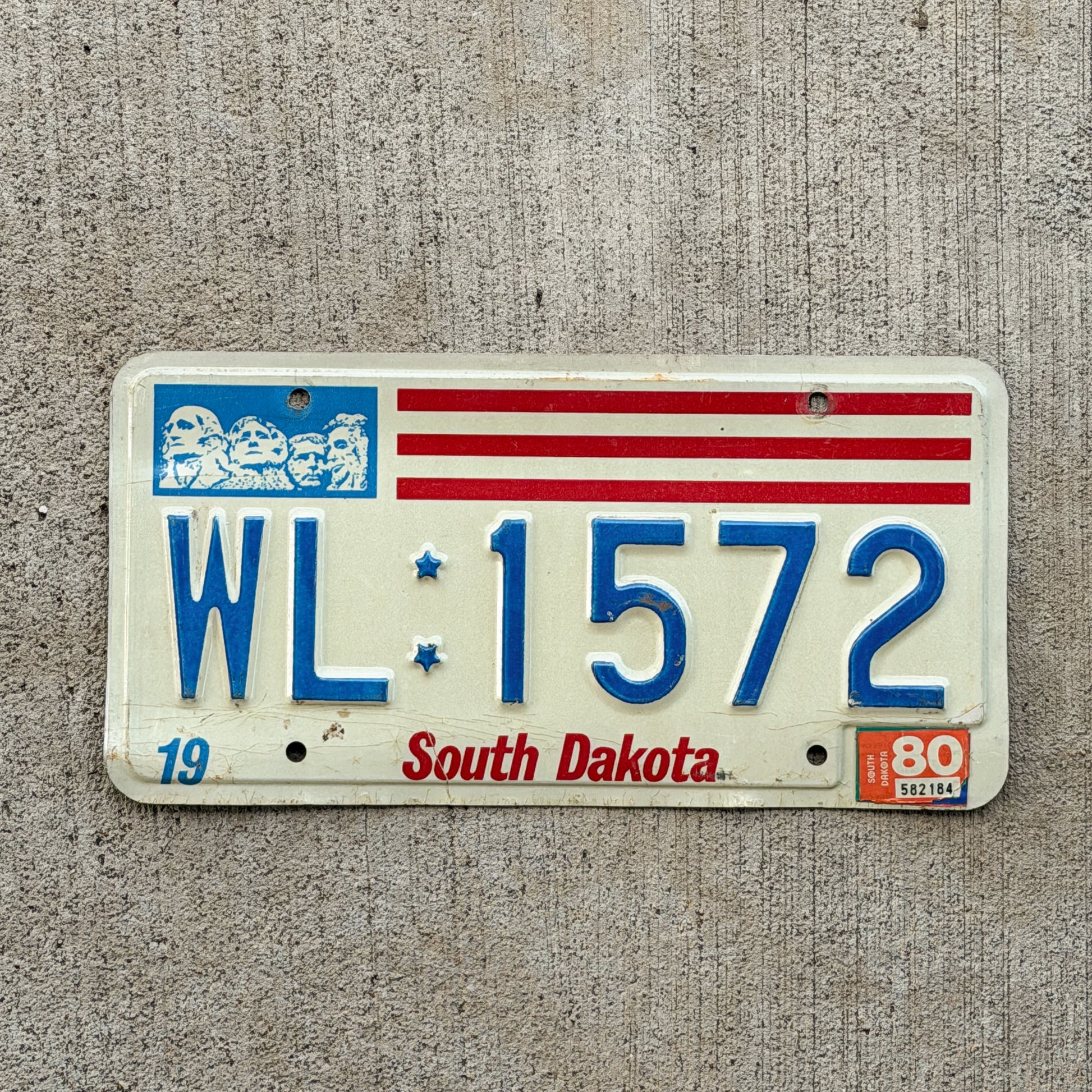 Photo of a 1976 1980 South Dakota License Plate Auto Tag Garage Decor Vintage WL 1572 with original patina