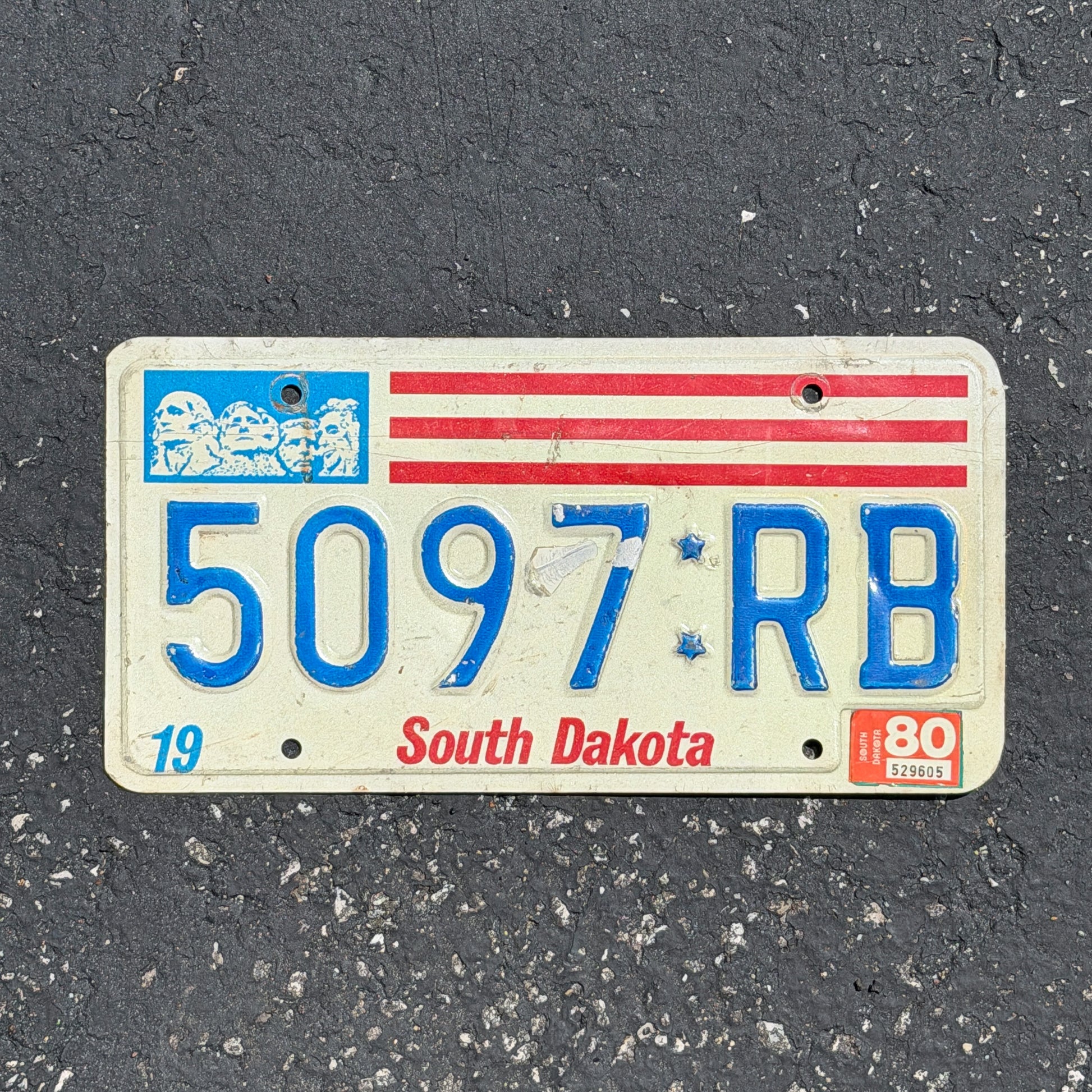 Photo of a 1976 1980 South Dakota Truck License Plate Auto Tag Garage Decor Vintage Bicentennial 5097 RB with original patina