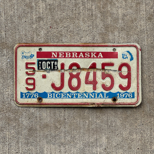 Photo of a 1976 1983 Nebraska License Plate Auto Tag Garage Decor Vintage Bicentennial 59 J8459 with original patina