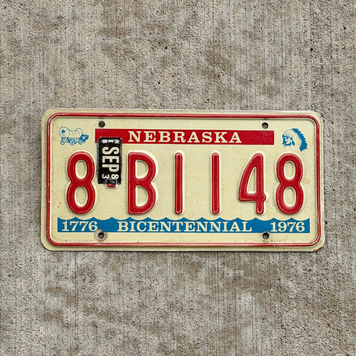Photo of a 1976 1983 Nebraska License Plate Auto Tag Garage Decor Vintage Bicentennial 8 B1148 with original patina