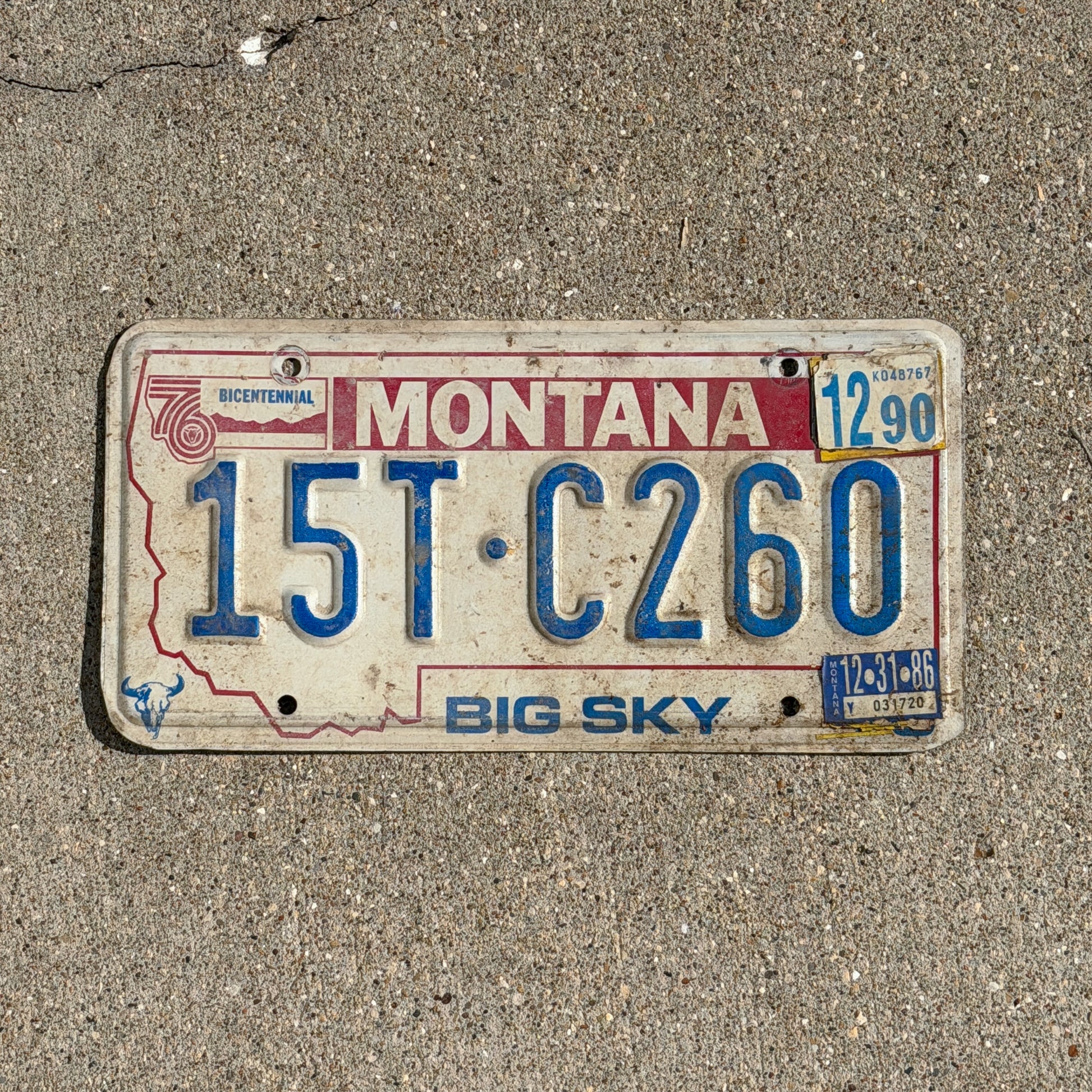 Photo of a 1976 1990 Montana Truck License Plate Auto Tag Garage Decor Vintage Bicentennial 15 TC 260 with original patina
