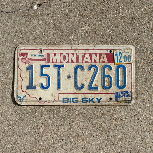 Photo of a 1976 1990 Montana Truck License Plate Auto Tag Garage Decor Vintage Bicentennial 15 TC 260 with original patina