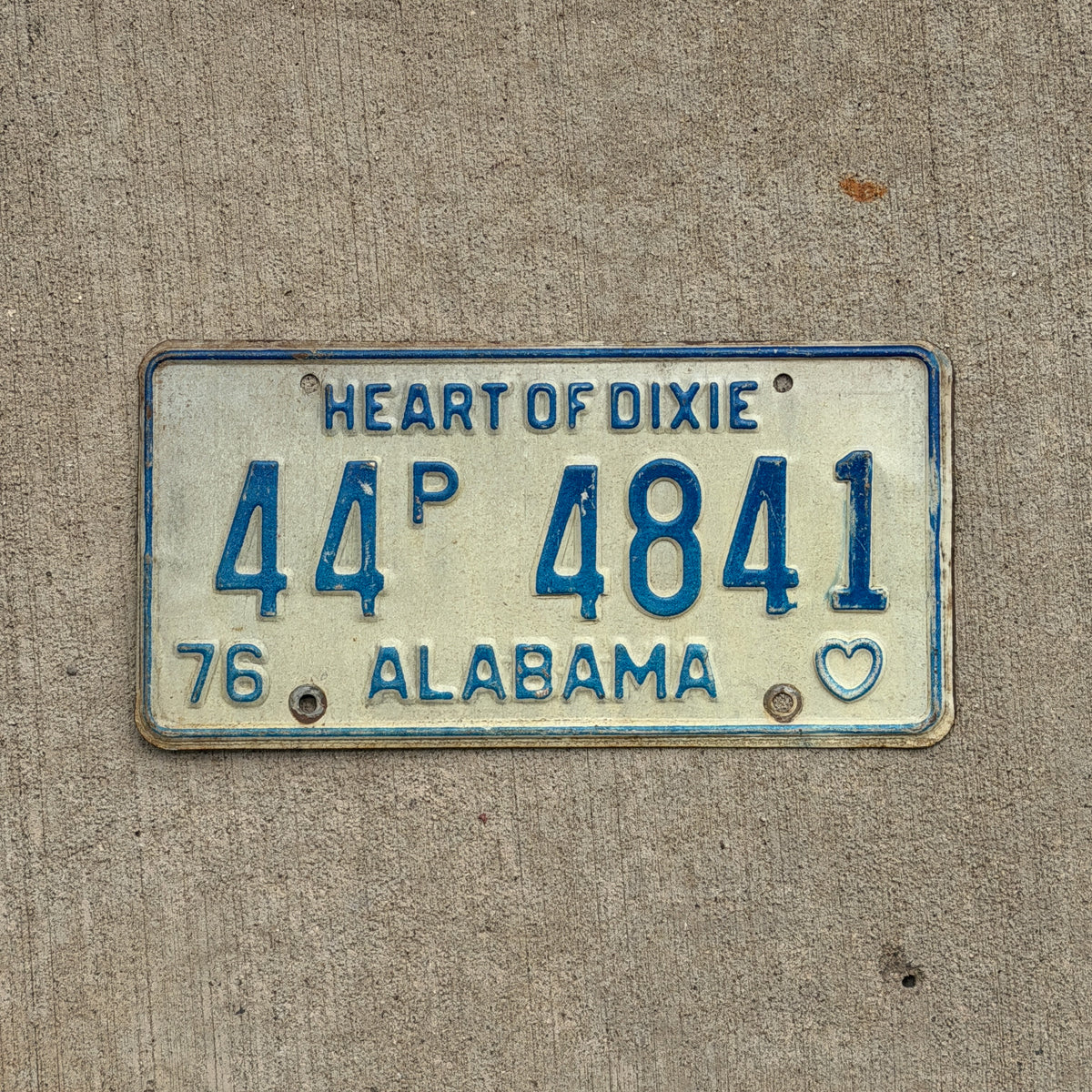 Photo of a 1976 Alabama Truck License Plate Auto Tag Garage Decor Vintage 44 P 4841 with original patina