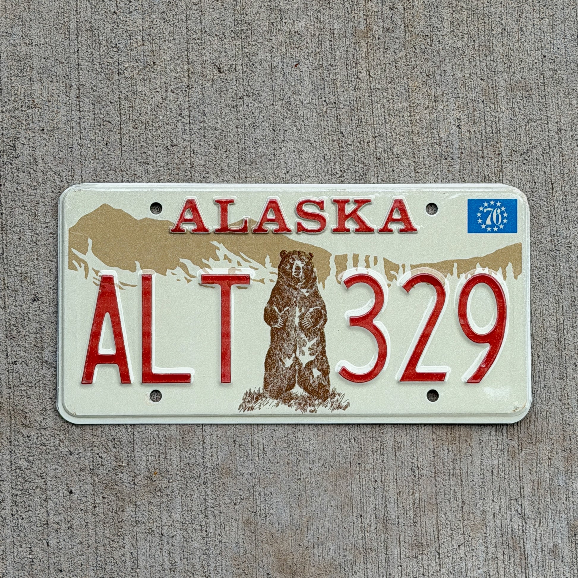 Photo of a 1976 Alaska License Plate Auto Tag 1 Vintage Garage Bicentennial Bear ALT 329 with original patina