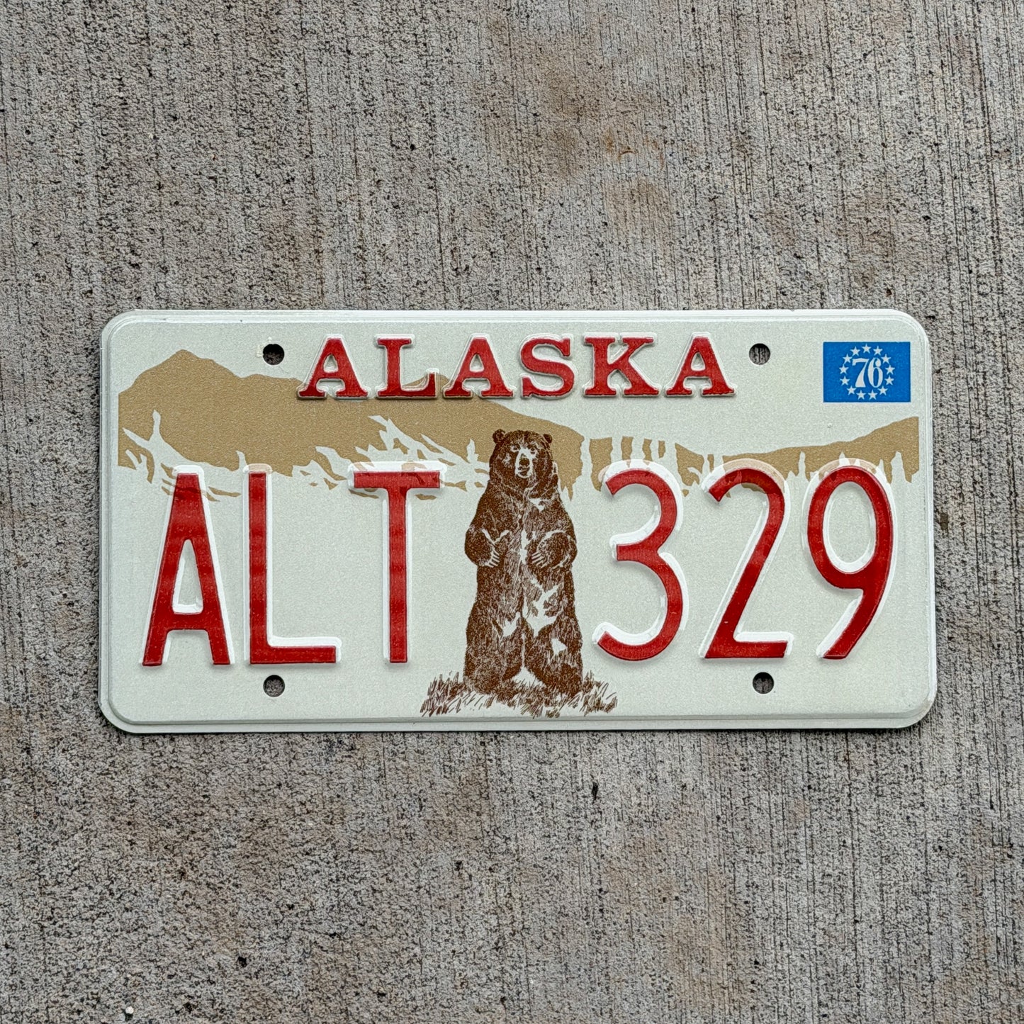 Photo of a 1976 Alaska License Plate Auto Tag 2 Vintage Garage Bicentennial Bear ALT 329 with original patina