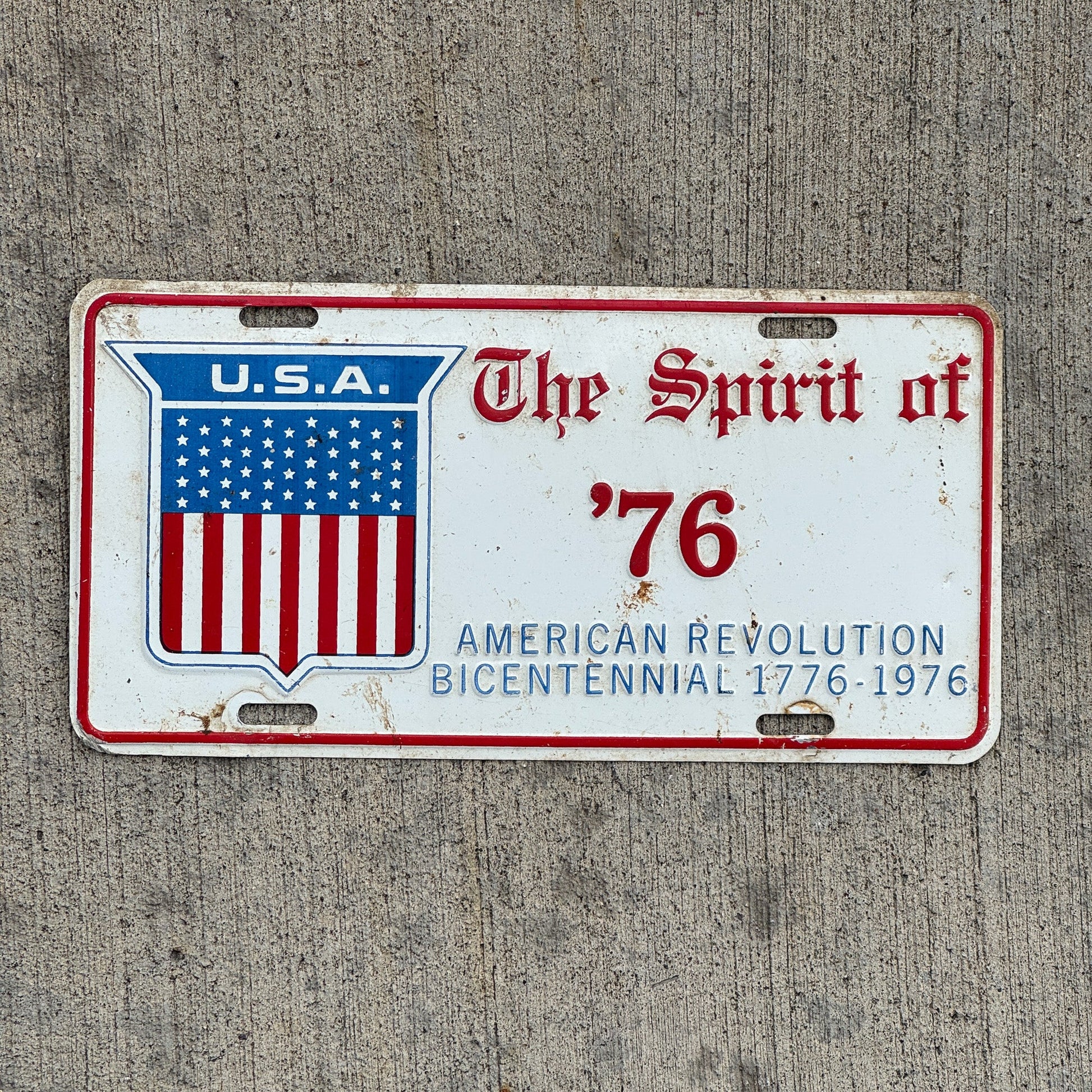 Photo of a 1976 Auto Tag Garage Decor Vintage American Revolution Bicentennial Spirit of '76 with original patina