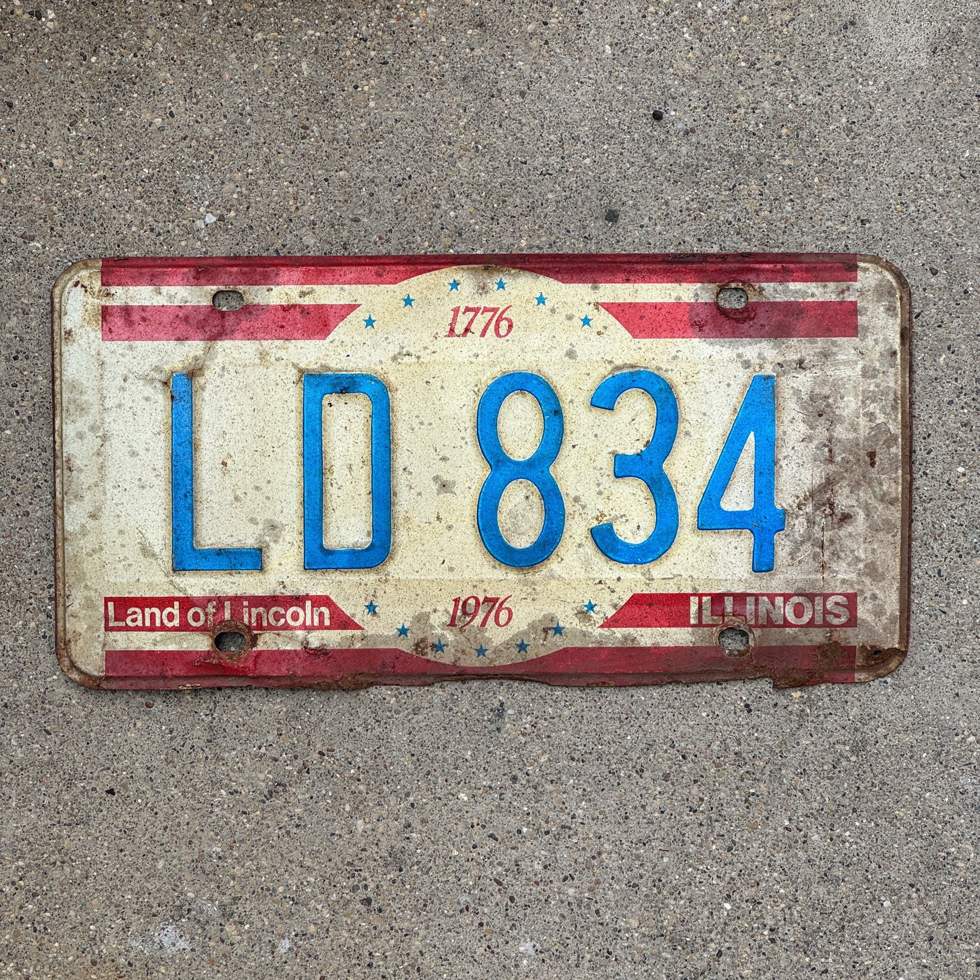 Photo of a 1976 Illinois License Plate Auto Tag 1 Vintage Garage Bicentennial LD 834 with original patina